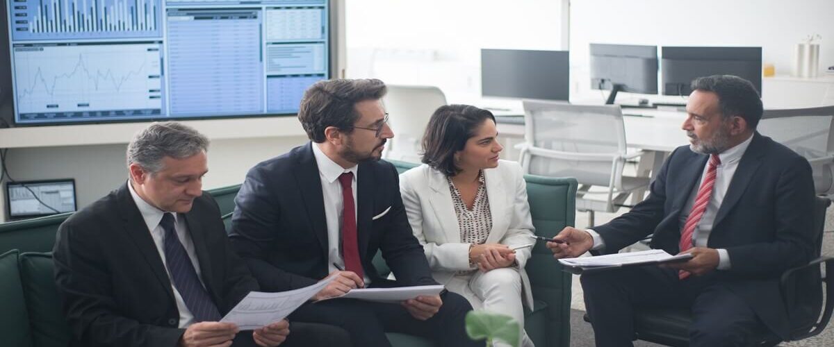 showing sales people having an internal sales meeting